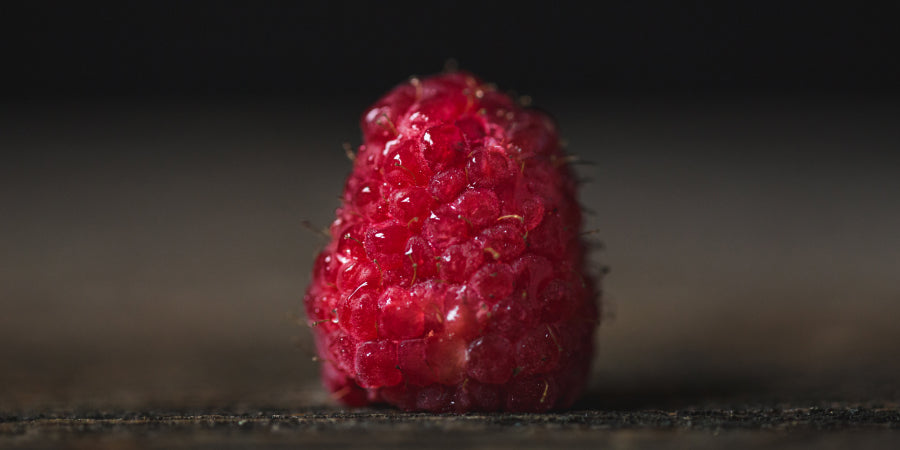 washed raspberrry on table
