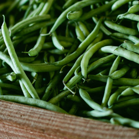 Fresh green beans in wooden box