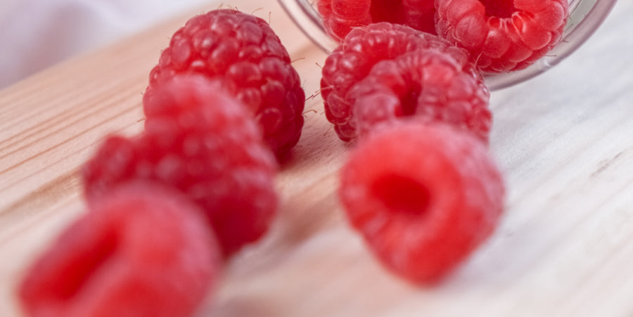 raspberries on cutting board