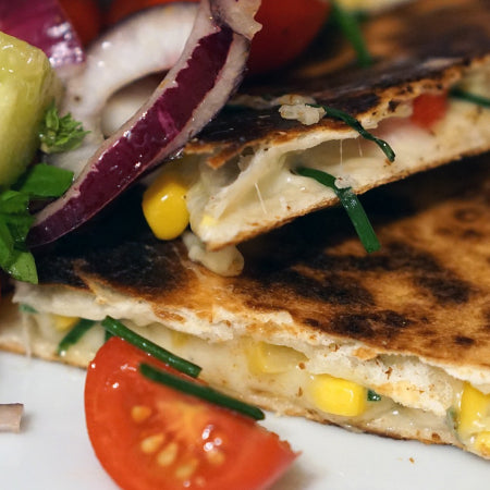 quesadillas on a plate with freeze dried corn