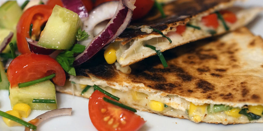 quesadillas on a plate with freeze dried corn