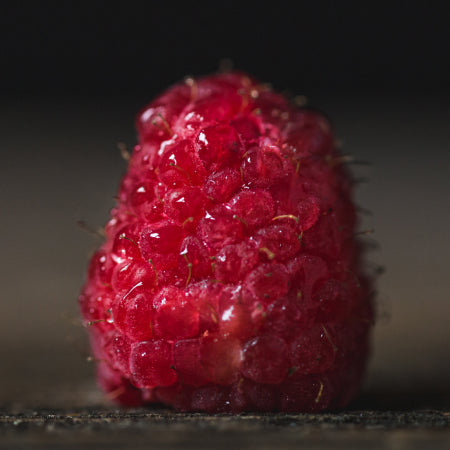 washed raspberrry on table