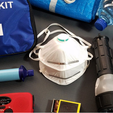 first aid kit backpack contents on a table