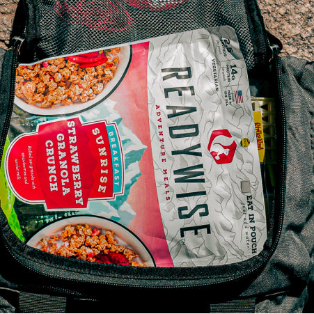 Survival kit backpack with a readywise emergency food pouch inside