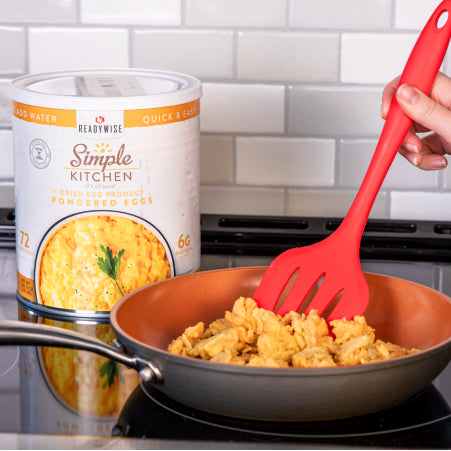 woman making scrambled eggs with Readywise egg powder