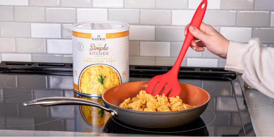 woman making scrambled eggs with Readywise egg powder