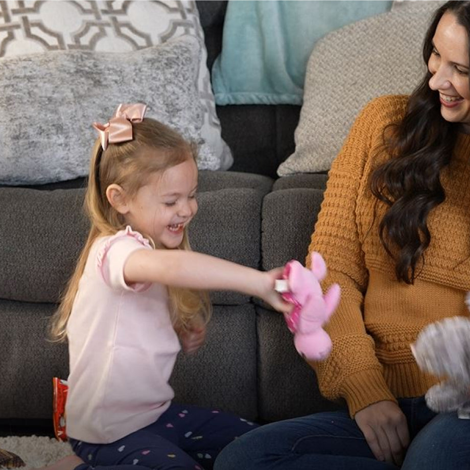 Mother & daughter playing in the living room